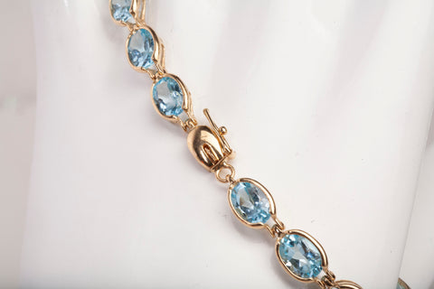 Ladies 14k Yellow Gold Oval Cut Synthetic Aquamarine Tennis Bracelet 7.75"