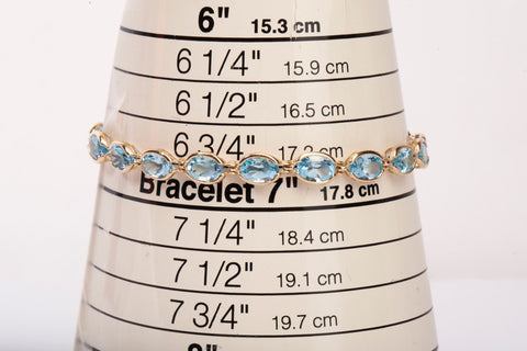 Ladies 14k Yellow Gold Oval Cut Synthetic Aquamarine Tennis Bracelet 7.75"