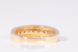 Ladies 14k Yellow Gold Round Cut Channel Set Diamond Band 0.12CTW