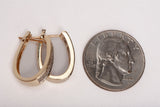 Ladies 14k Yellow Gold Oval Shaped Hoops with Diamond Accents