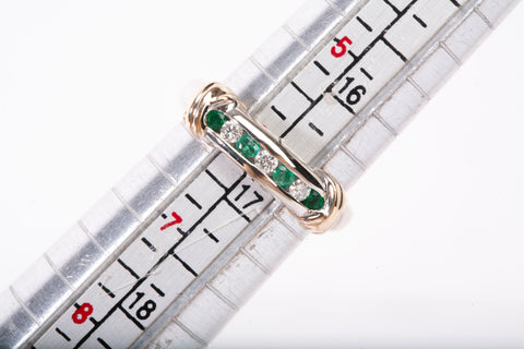 Ladies 14k Two-Tone Channel Set Diamond and Emerald Half Eternity Band