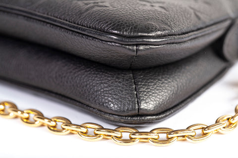 Authentic Louis Vuitton Black Monogram Empreinte Leather Liv Pochette