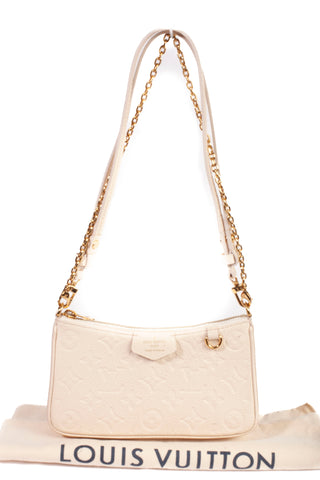 Authentic Cream Louis Vuitton Empreinte Easy Pouch On Strap