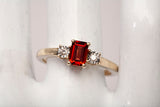 Ladies 14k Yellow Gold Garnet Emerald Cut with Diamond Accents Ring