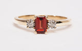 Ladies 14k Yellow Gold Garnet Emerald Cut with Diamond Accents Ring