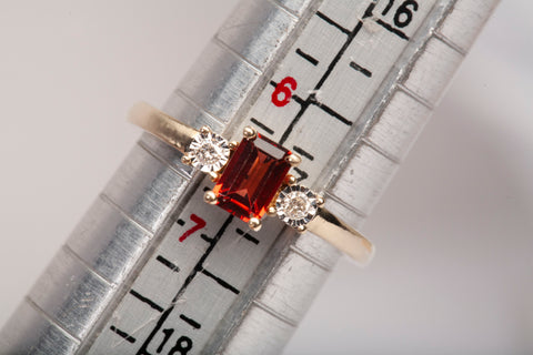 Ladies 14k Yellow Gold Garnet Emerald Cut with Diamond Accents Ring