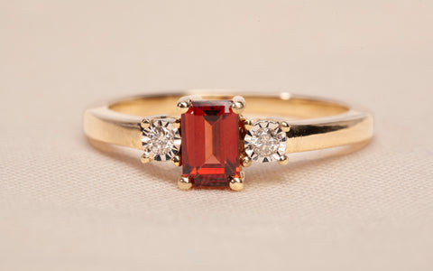 Ladies 14k Yellow Gold Garnet Emerald Cut with Diamond Accents Ring