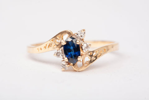 Ladies 10k Yellow Gold Sapphire with Diamond Accents Bypass Ring