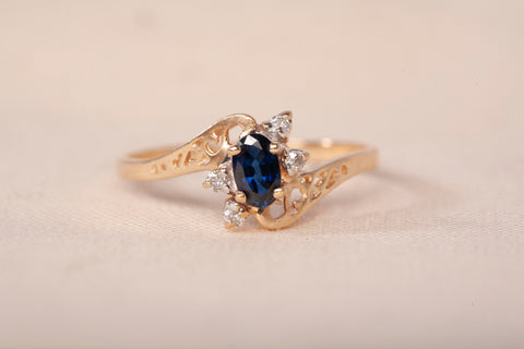Ladies 10k Yellow Gold Sapphire with Diamond Accents Bypass Ring