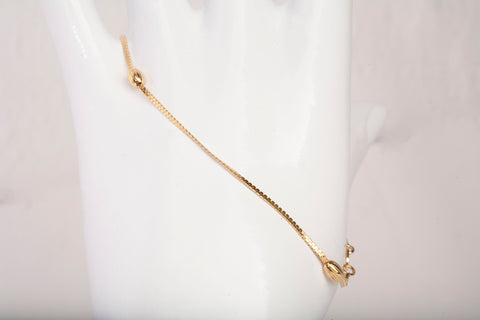Ladies 18k Yellow Gold Oval Bead Station Bracelet