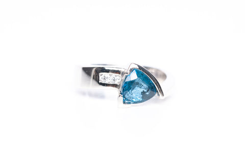 Ladies 14k White Gold Blue Topaz Diamond Accent Ring .06CTW