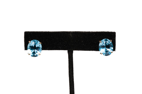 Ladies 14k Yellow Gold Oval Cut Blue Topaz Stud Earrings